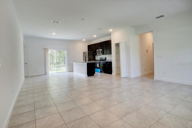 unfurnished living room featuring light tile patterned flooring