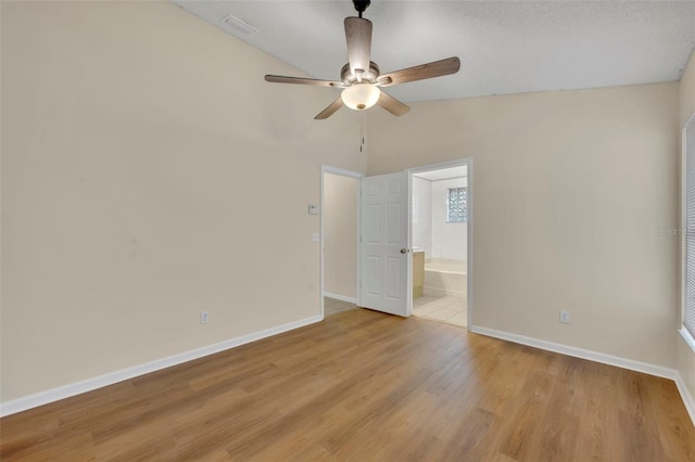 2519 Woods Edge Cir, Orlando, FL 32817 - spare room featuring lofted ceiling, light wood finished floors, baseboards, and ceiling fan