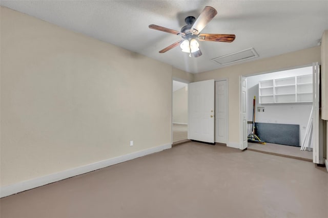 2519 Woods Edge Cir, Orlando, FL 32817 - unfurnished bedroom with attic access, baseboards, concrete floors, and ceiling fan