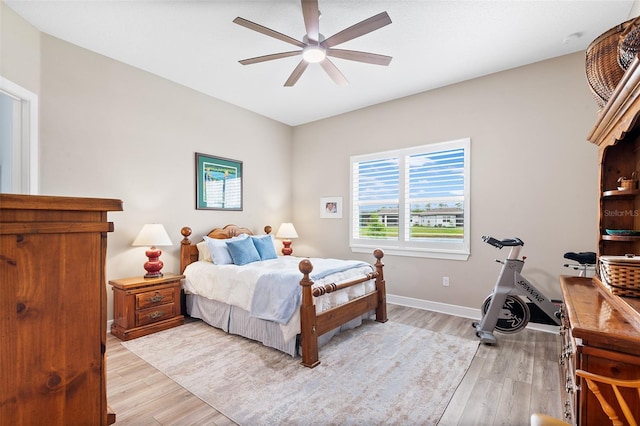 bedroom featuring ceiling fan and light hardwood / wood-style floors