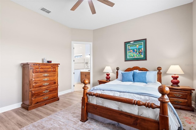 bedroom with connected bathroom, light hardwood / wood-style flooring, and ceiling fan