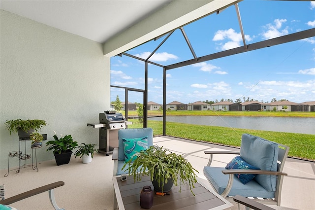 sunroom / solarium with a water view