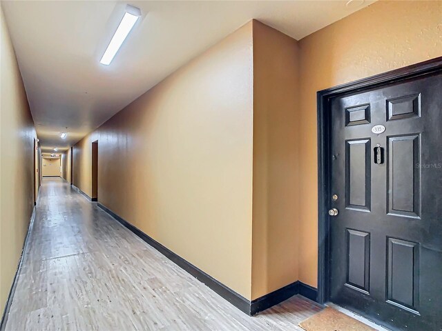 hall with light wood-type flooring