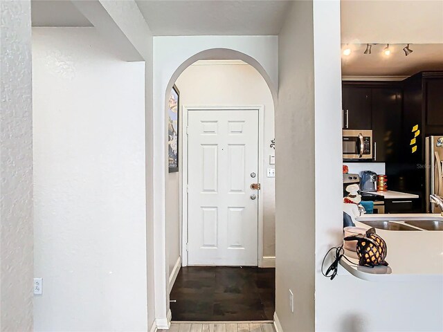 entryway with hardwood / wood-style floors