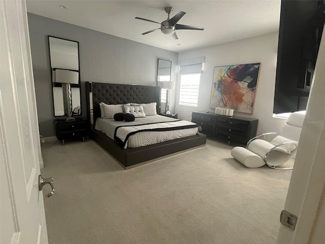 bedroom featuring ceiling fan and carpet floors