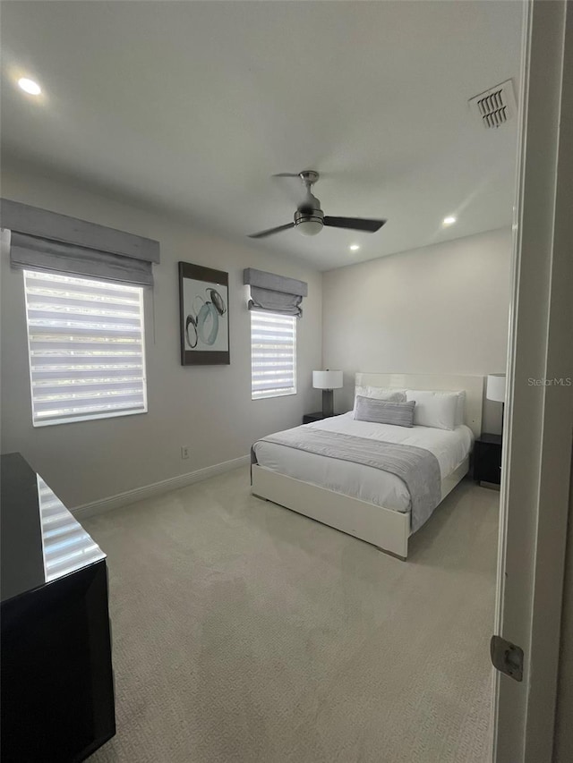 carpeted bedroom featuring ceiling fan