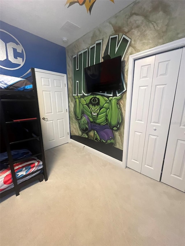 bedroom featuring a closet and carpet flooring