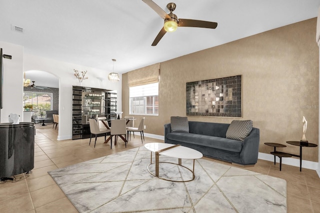 7416 Soiree Way, Reunion, FL 34747 - living room featuring ceiling fan, arched walkways, and tile patterned flooring