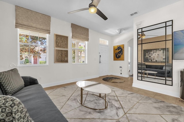 7416 Soiree Way, Reunion, FL 34747 - living area featuring ceiling fan and tile patterned floors