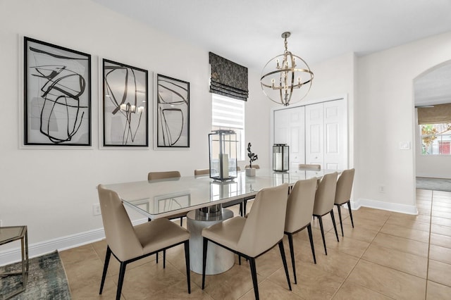 7416 Soiree Way, Reunion, FL 34747 - dining space featuring arched walkways, a chandelier, and light tile patterned flooring