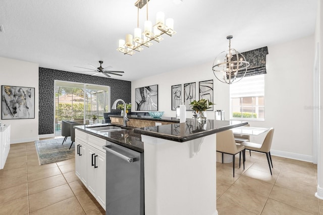 7416 Soiree Way, Reunion, FL 34747 - kitchen with a chandelier, stainless steel dishwasher, light tile patterned flooring, white cabinets, and ceiling fan