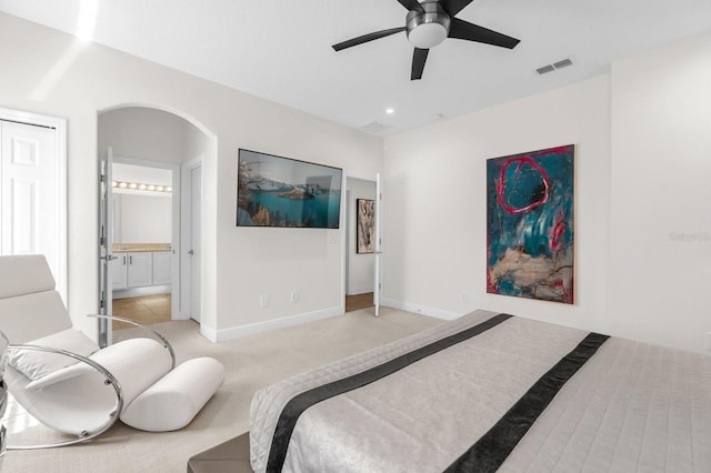 7416 Soiree Way, Reunion, FL 34747 - bedroom featuring light carpet, recessed lighting, ensuite bath, and ceiling fan
