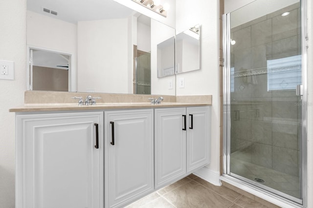 7416 Soiree Way, Reunion, FL 34747 - full bath with double vanity, a shower stall, and tile patterned floors