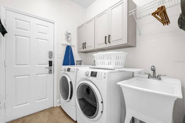 7416 Soiree Way, Reunion, FL 34747 - laundry room featuring washer and dryer, cabinet space, and light tile patterned floors
