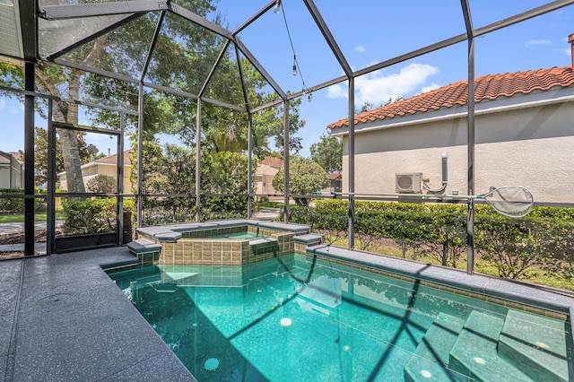 7416 Soiree Way, Reunion, FL 34747 - view of swimming pool featuring a pool with connected hot tub and a lanai
