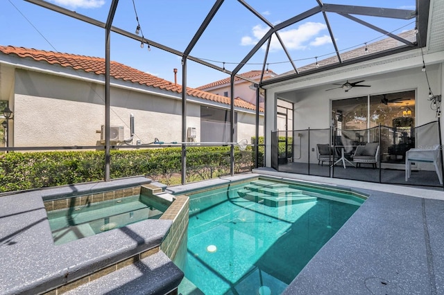 7416 Soiree Way, Reunion, FL 34747 - view of swimming pool with ceiling fan, a pool with connected hot tub, a lanai, and a patio