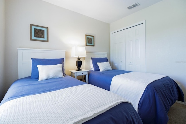 carpeted bedroom featuring a closet