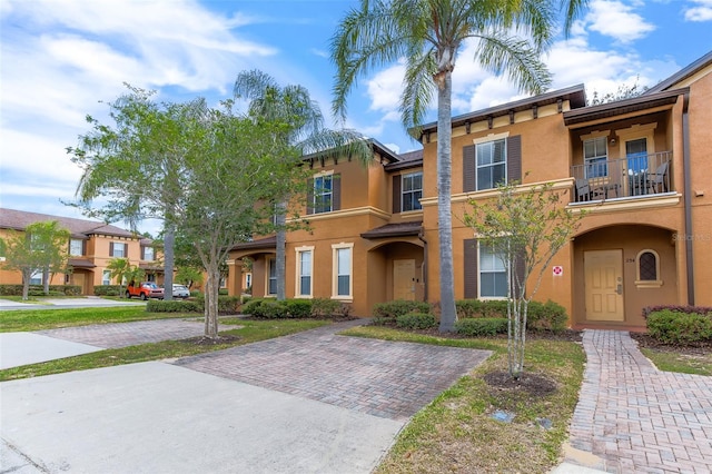 view of front of property with a balcony