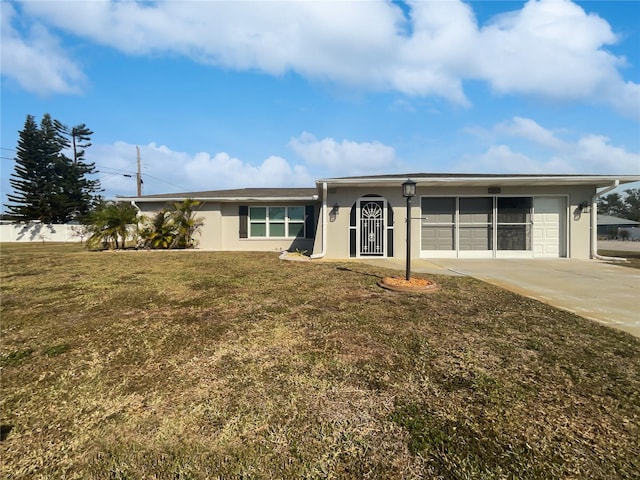 ranch-style home with a garage and a front yard