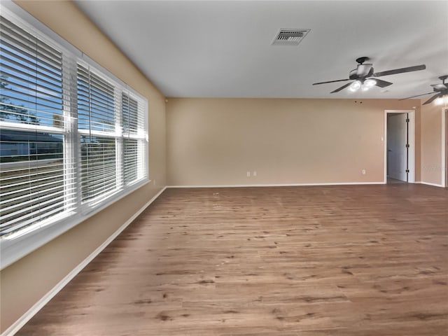 empty room featuring ceiling fan and wood-type flooring