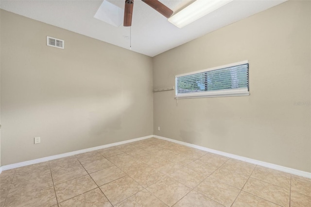 unfurnished room featuring ceiling fan and light tile patterned floors