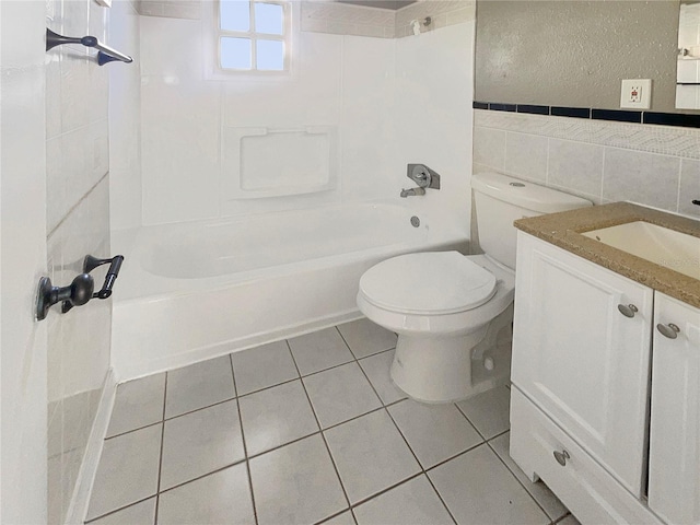 full bathroom featuring tile patterned floors, vanity, shower / washtub combination, tile walls, and toilet