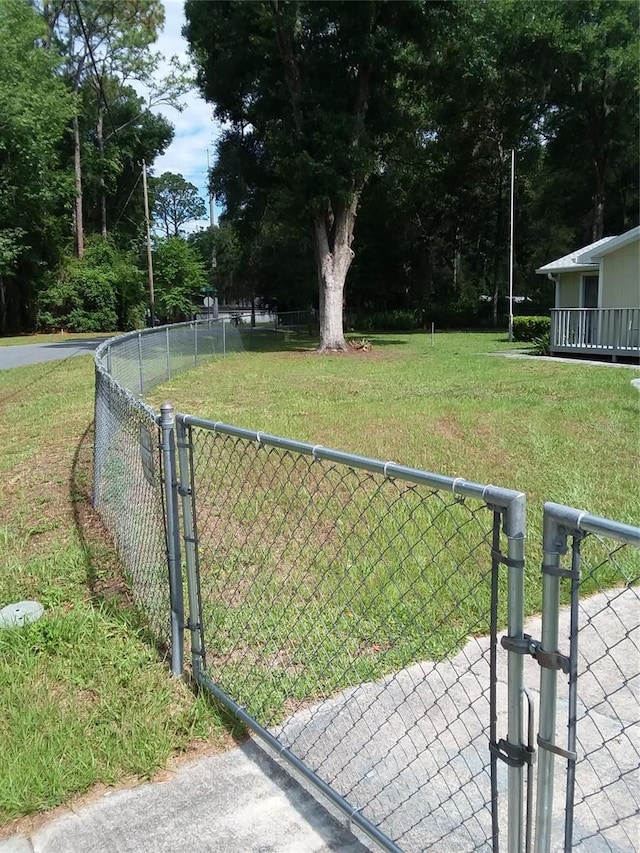 view of yard with a gate and fence