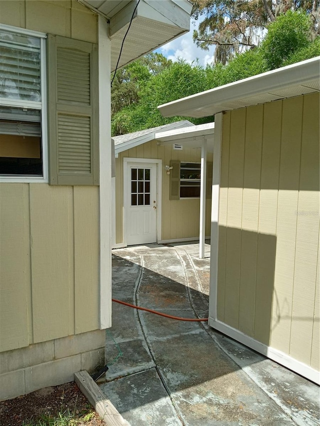 doorway to property featuring a patio