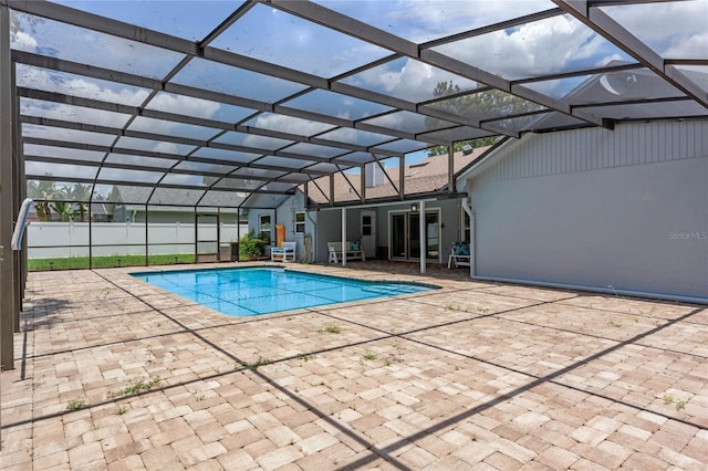 view of pool with a lanai and a patio area