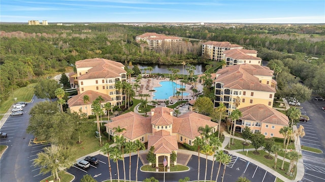 8801 Worldquest Blvd Unit 4406, Orlando, FL 32821 - birds eye view of property featuring a water view and a wooded view