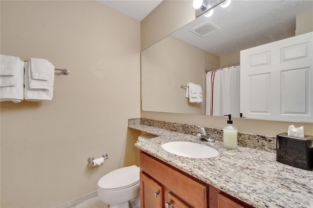 8801 Worldquest Blvd Unit 4406, Orlando, FL 32821 - bathroom featuring vanity, toilet, baseboards, visible vents, and curtained shower