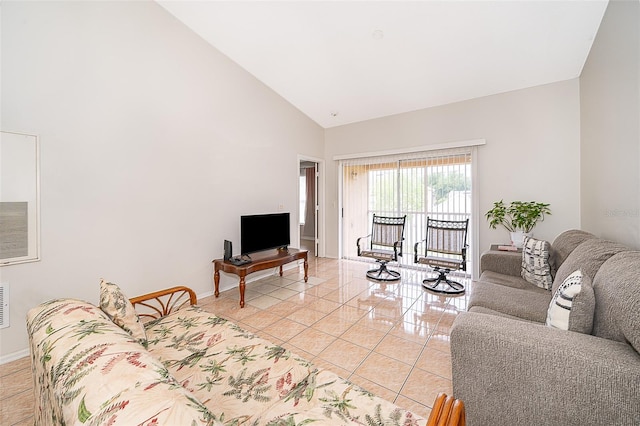 tiled living room featuring high vaulted ceiling