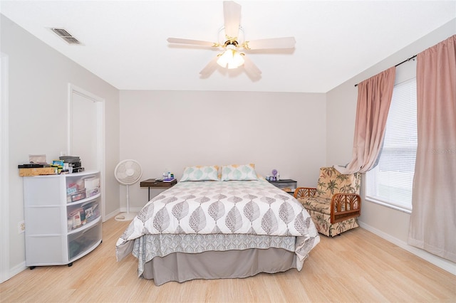 bedroom featuring hardwood / wood-style flooring and ceiling fan