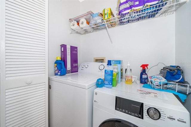 clothes washing area featuring washer and dryer