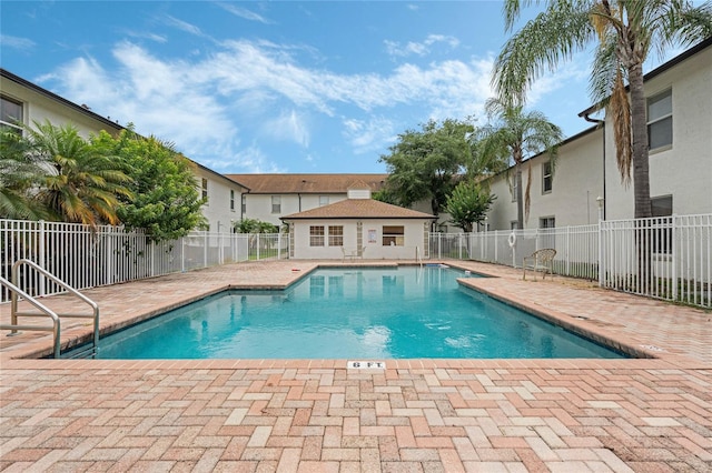 pool featuring a patio and fence