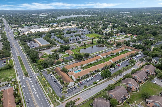 birds eye view of property with a water view and a residential view