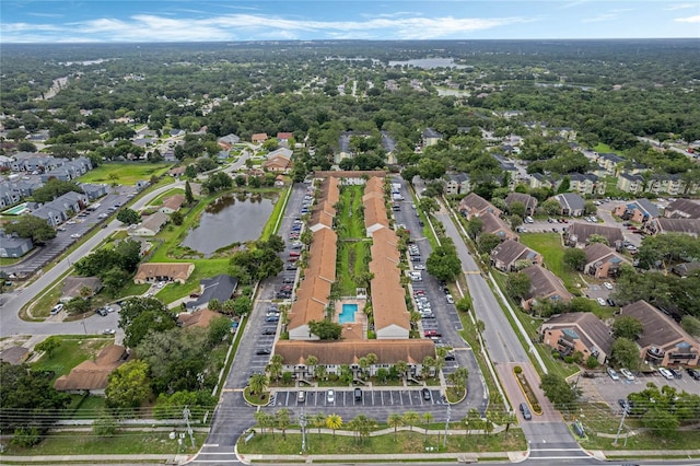 birds eye view of property with a residential view and a water view