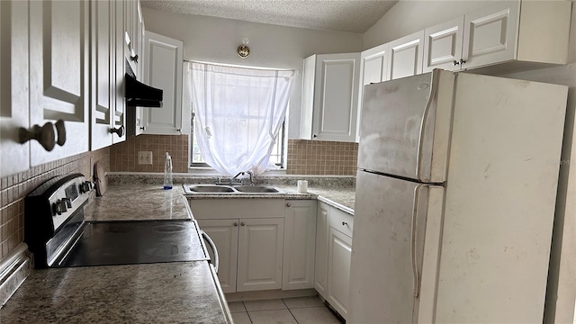 1204 Easton St, Orlando, FL 32825 - kitchen featuring freestanding refrigerator, a sink, electric stove, backsplash, and a textured ceiling