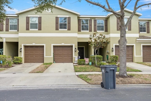 townhome / multi-family property featuring a garage