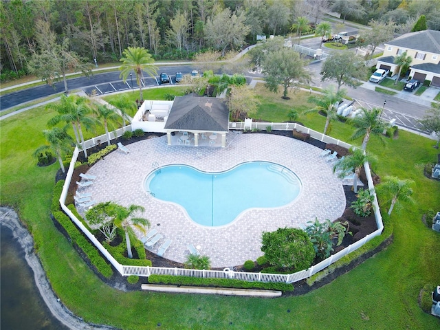 view of swimming pool featuring a patio and a lawn