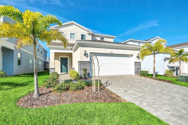 view of front of property featuring a garage and a front yard