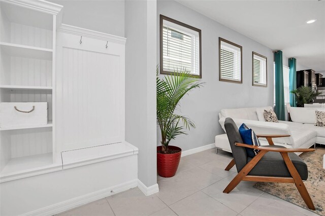 interior space featuring built in features and light tile flooring