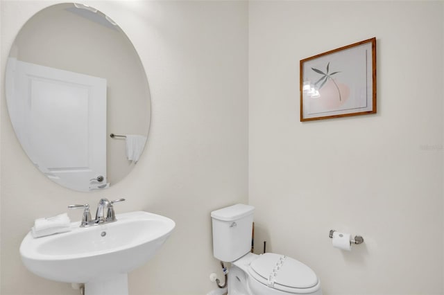 bathroom with sink and toilet