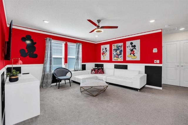 living room featuring carpet flooring and ceiling fan