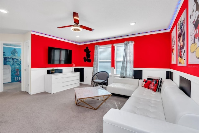 carpeted living room with ceiling fan