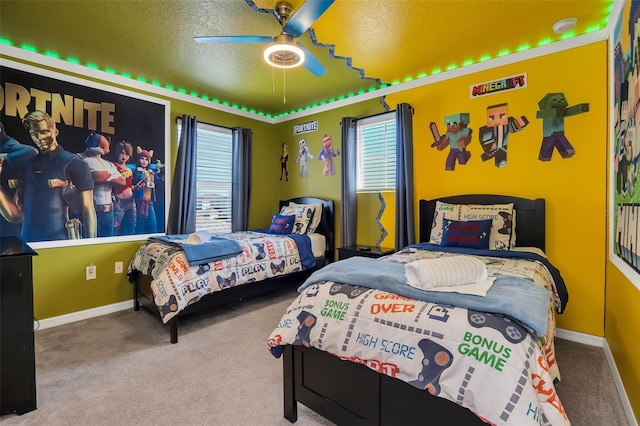 bedroom with a textured ceiling, carpet floors, and ceiling fan