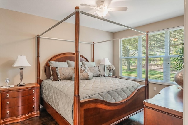 bedroom featuring dark wood-style flooring and a ceiling fan