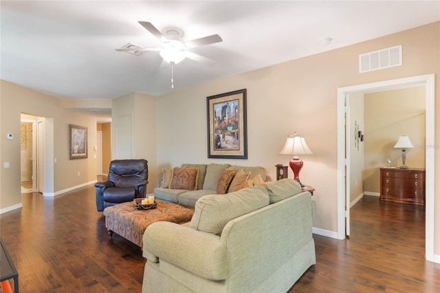 living area featuring ceiling fan, dark wood finished floors, visible vents, and baseboards