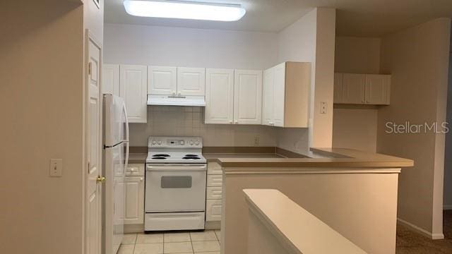 kitchen featuring light tile patterned floors, white appliances, white cabinets, and kitchen peninsula