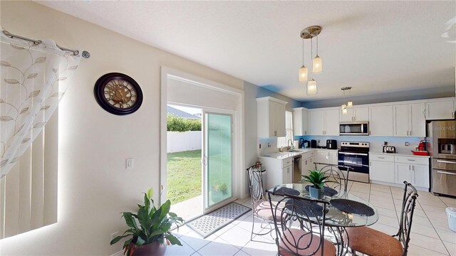 tiled dining space with sink